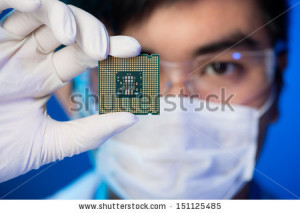 stock-photo-cropped-image-of-an-engineer-showing-a-computer-microchip-on-the-foreground-151125485